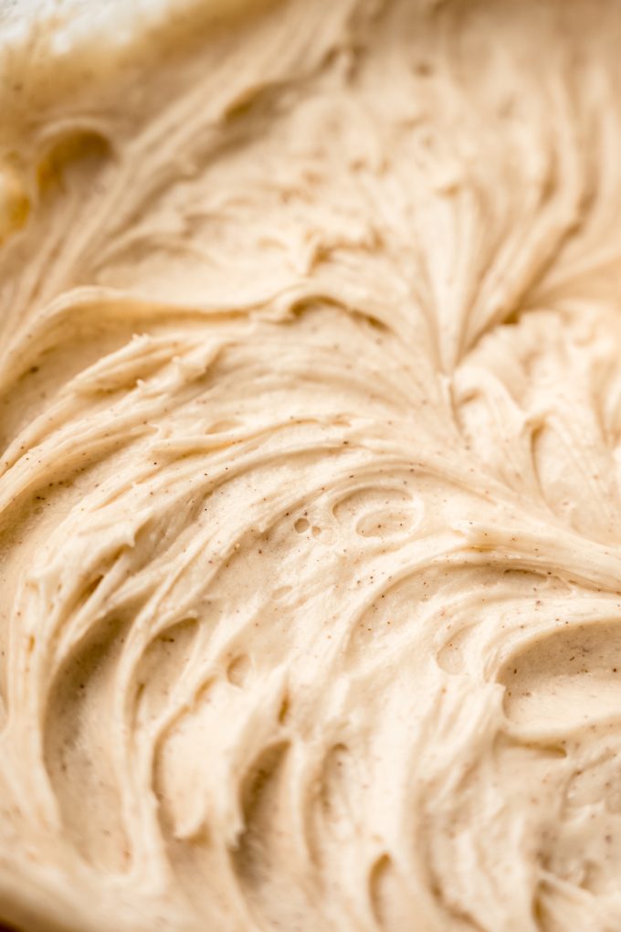 Closeup of maple cinnamon cream cheese frosting in a bowl.